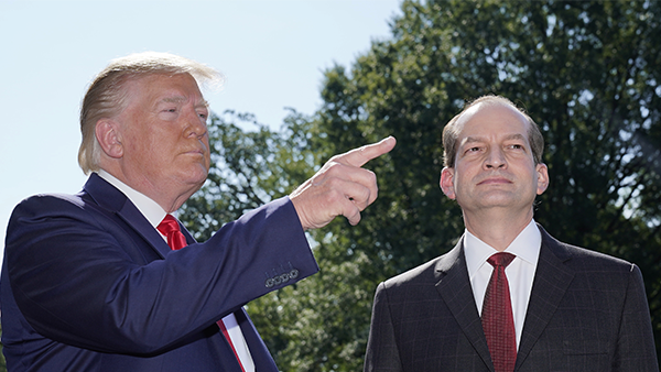 President Trump points alongside former Labor Secretary Acosta. 