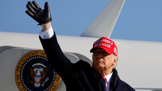 U.S. President Donald Trump gestures as he leaves after holding a campaign rally at Fayetteville Regional Airport