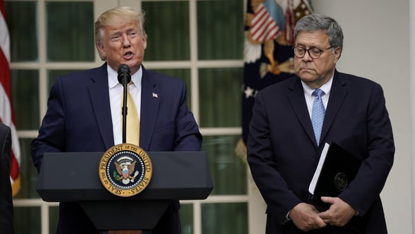 U.S. President Donald Trump stands with Attorney General Bill Barr