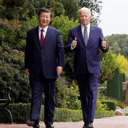U.S. President Joe Biden and Chinese President Xi Jinping walk during meeting.