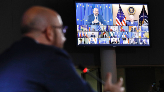 U.S. President Joe Biden and President of the European Council Charles Michel are seen on a large television screen