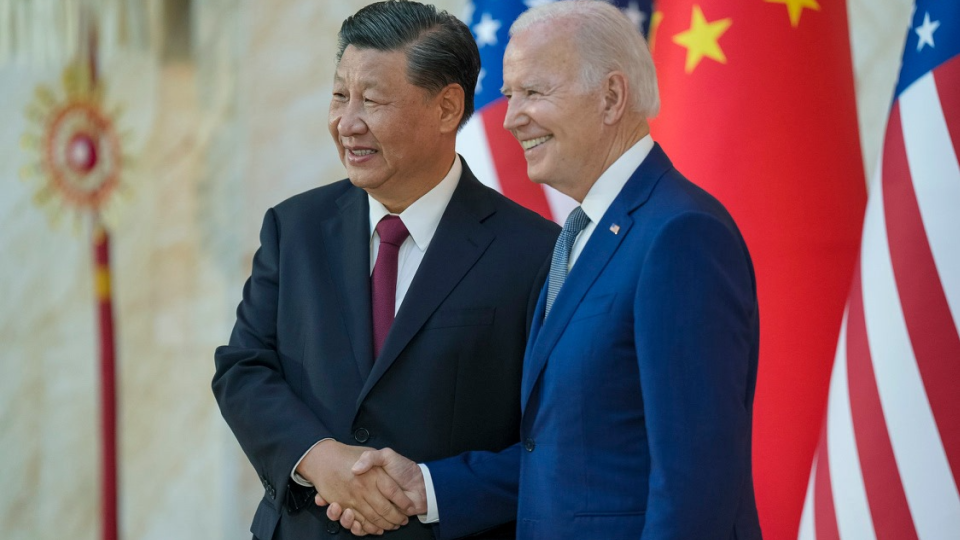 U.S. President Joe Biden shakes hands with Chinese President Xi Jinping as they meet on the G-20 summit sidelines