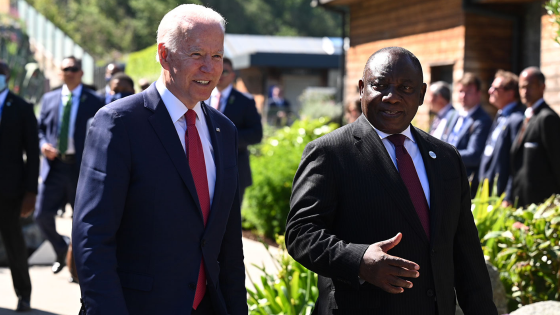 U.S. President Joe Biden talks with South African President Cyril Ramaphosa as they arrive for a working session during G7 summit