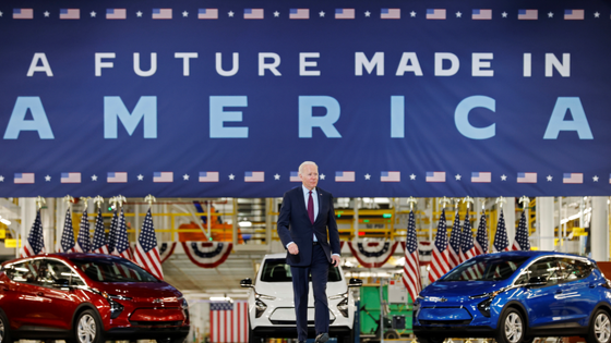 U.S. President Joe Biden walks to deliver remarks after touring the General Motors electric vehicle assembly plant