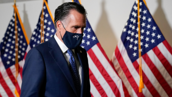 U.S. Senator Mitt Romney arrives to a luncheon on Capitol Hill in Washington.