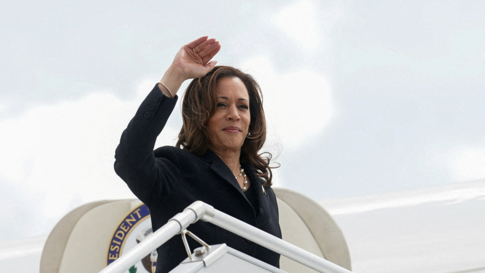 U.S. Vice President Kamala Harris waves as she departs to return to Washington at George Bush Intercontinental Airport in Houston