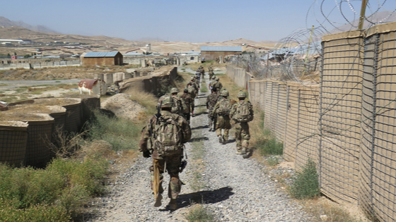 U.S. military advisers from the 1st Security Force Assistance Brigade walk at an Afghan National Army base.