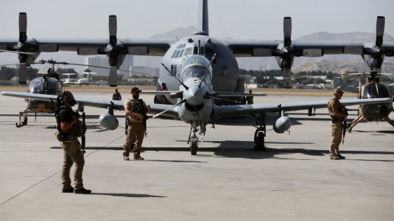 U.S. security personnel stand guard during a handover ceremony of A-29 Super Tucano planes from U.S. to the Afghan forces in Kabul