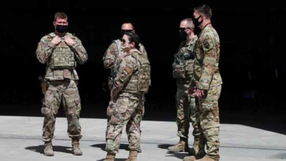 U.S. troops stand guard during a handover ceremony of A-29 Super Tucano planes