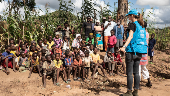 UNHCR official talks to children at a camp in Mozambique