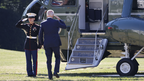 US President Joe Biden returns a salute on the South Lawn of the White House before boarding Marine One 