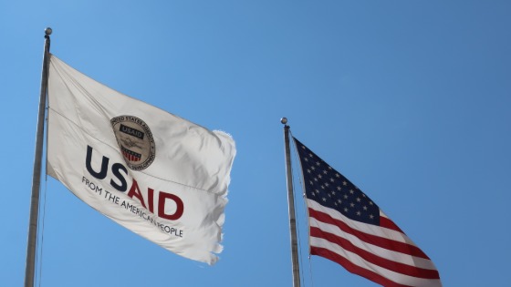 USAID flag next to American flag