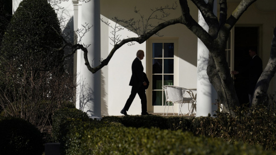 United States President Joe Biden enters the Oval Office of the White House in Washington, DC