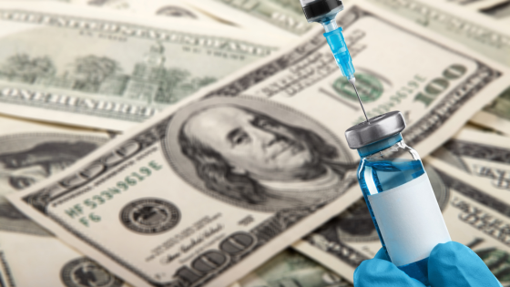 Vaccine vial against money backdrop