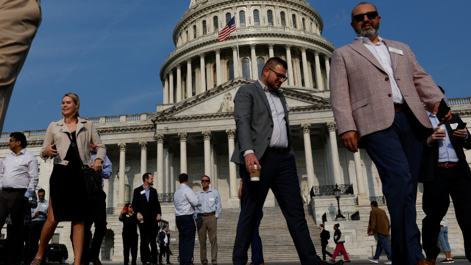 Visitors walk on the plaza at the U.S. Capitol in Washington