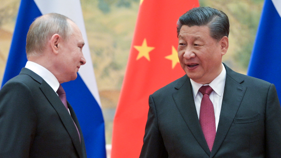 Vladimir Putin and Xi Jinping pose during a meeting at the Diaoyutai State Guesthouse