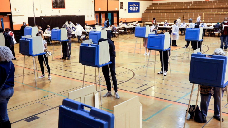 Voters fill out ballots at Riverside University High School during the 2020 presidential primaries