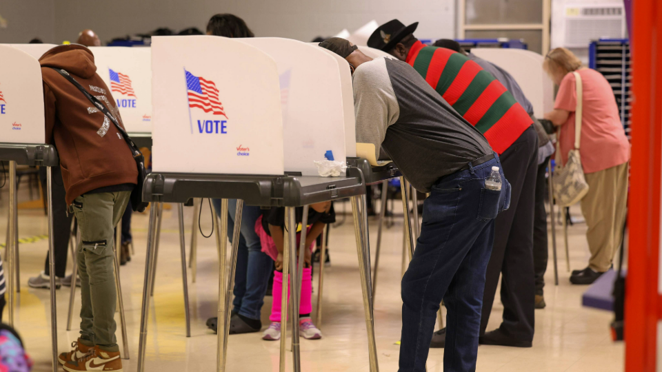 Voters fill out their ballots on the final night of early voting in Baltimore, Maryland