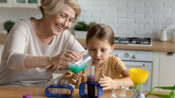 Woman and girl work on a science experiment