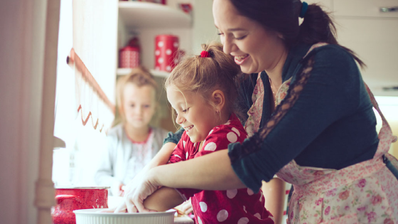 Woman making pie with daughter