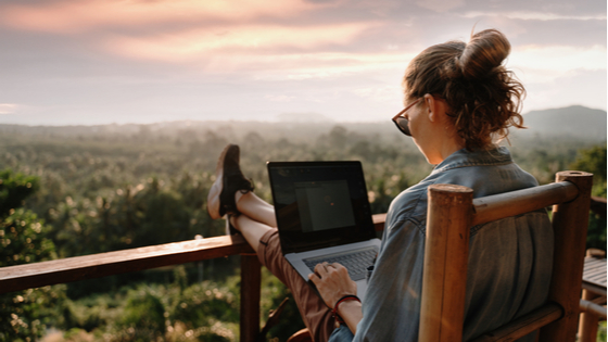 Woman remote working on porch