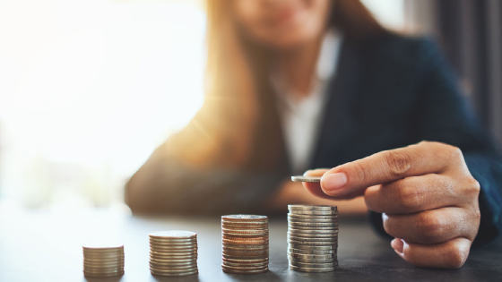 Woman stacking coins