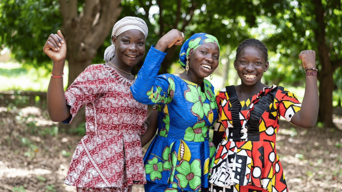 Women hold up arms to signal solidarity and strength