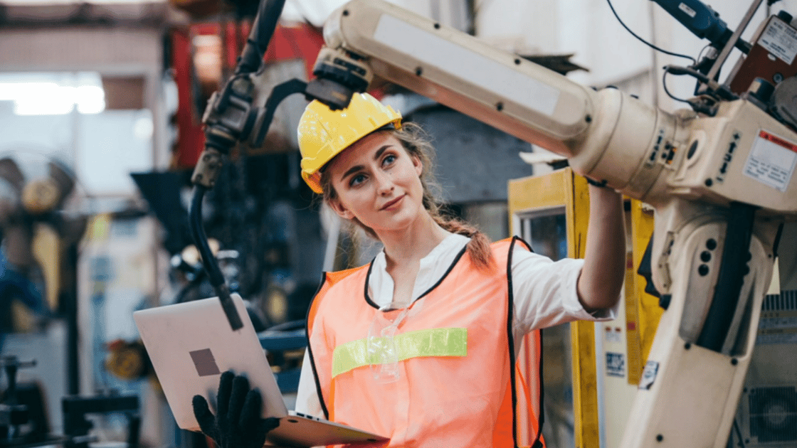 Worker does safety check on robotic arm