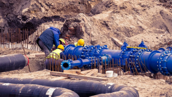 Workers fixing water pipes