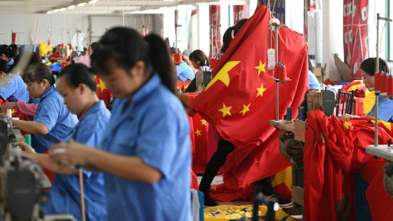 Workers make Chinese flags at a factory in Jiaxing