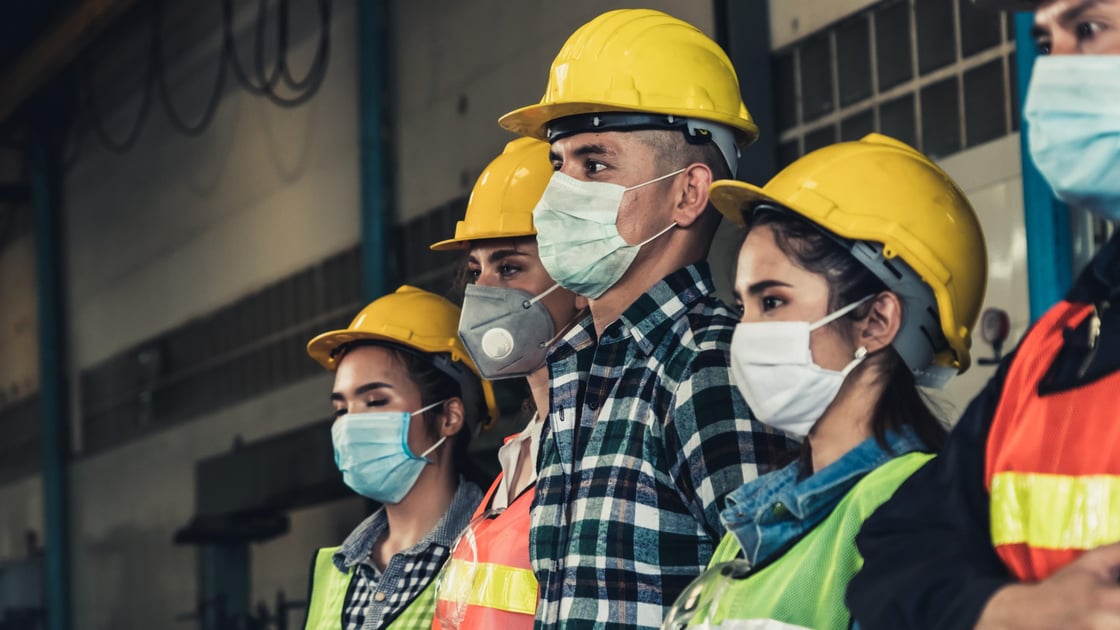 Workers wearing safety helmets