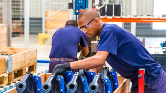 Young Africans at a manufacturing plant