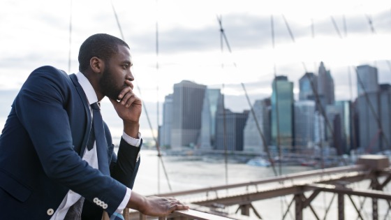 Young businessman on Brooklyn Bridge