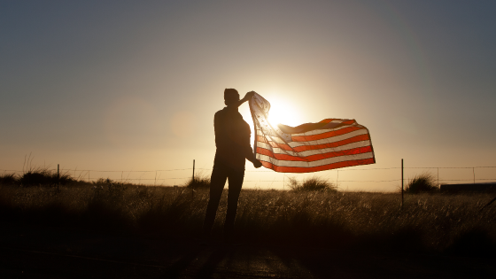 Young man waves U.S. flag