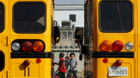 Young students get off school buses