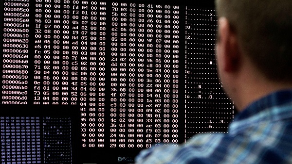 An analyst looks at code in the malware lab of a cyber security defense lab at the Idaho National Laboratory in Idaho Falls