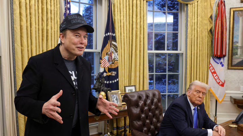 Elon Musk talks in the White House oval office