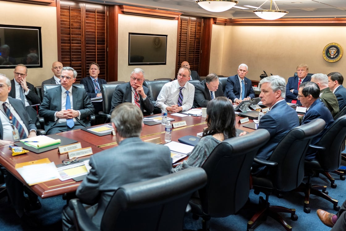 U.S. President Donald Trump and Vice President Mike Pence speak with senior White House advisors during a meeting about Iran missile attack on U.S. military facilities in Iraq, in the Situation Room of the White House, Washington